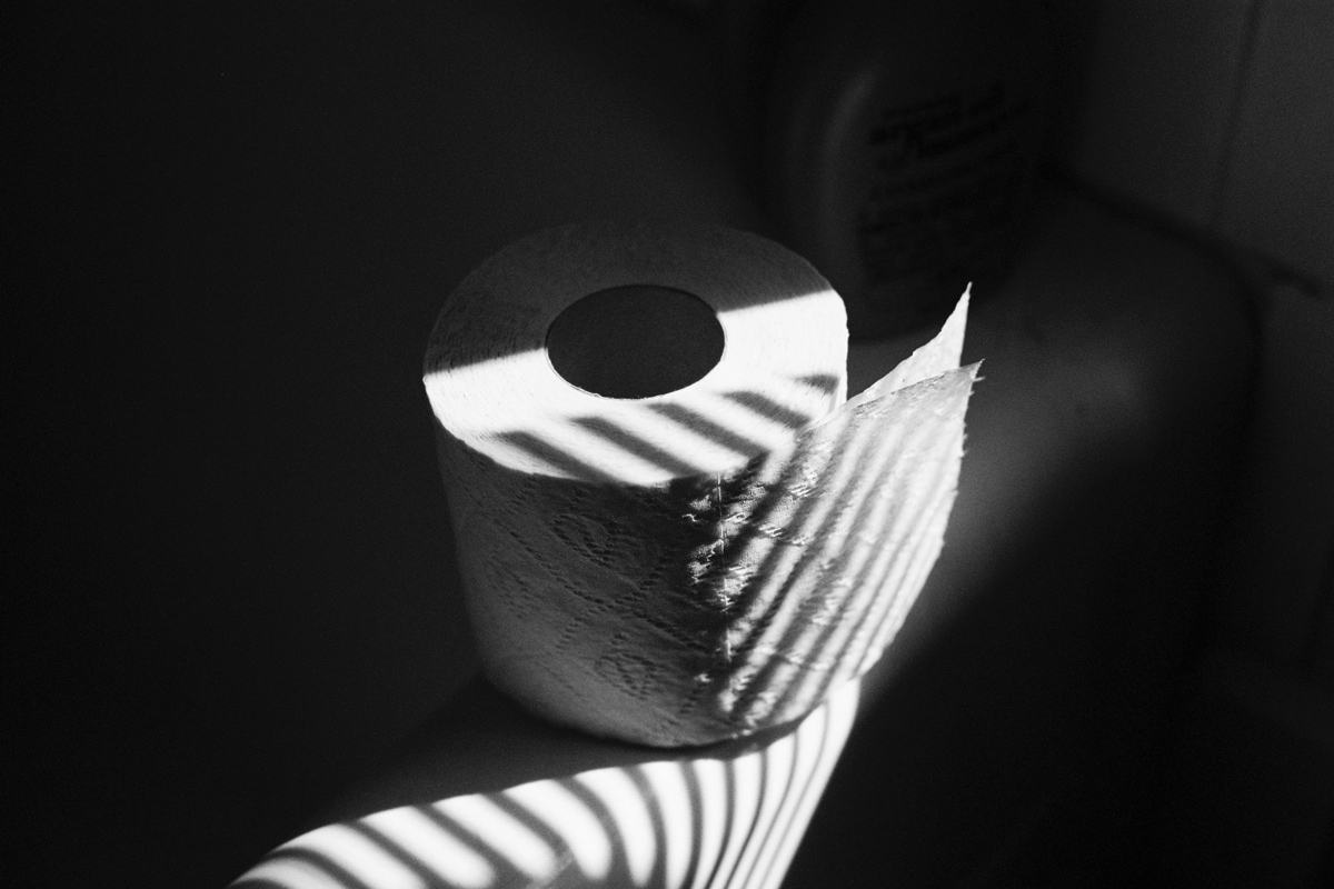 A black barbell with weights on the gym floor